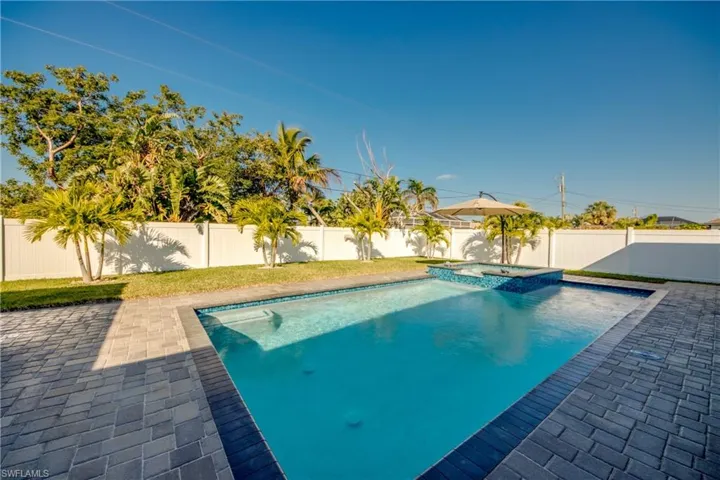 View of pool featuring a patio area and an in ground hot tub