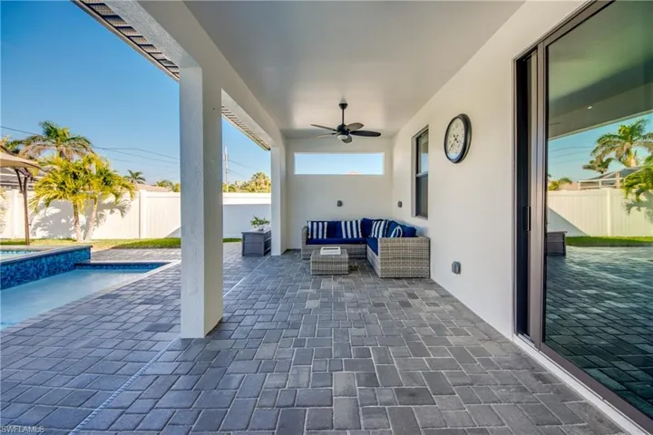 View of patio featuring an outdoor living space, a fenced in pool, and ceiling fan