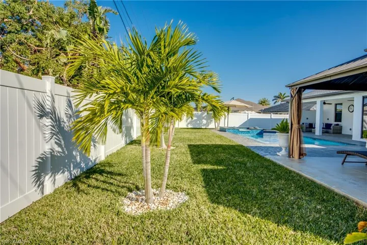 View of yard with a fenced in pool and a patio