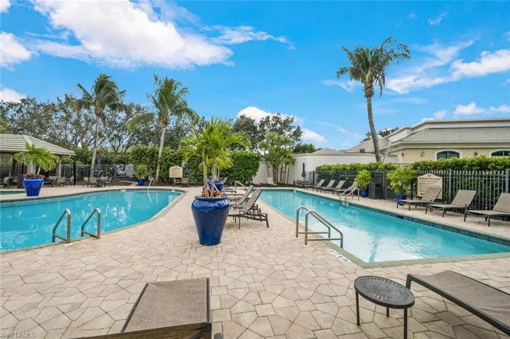 Pool featuring a patio and fence