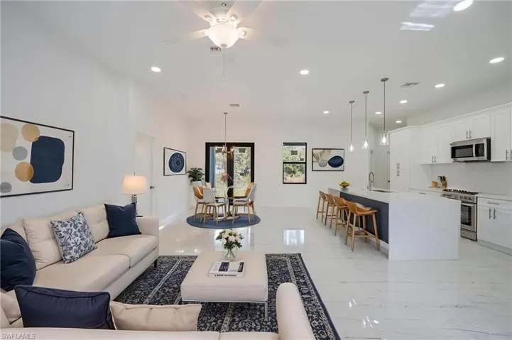 Living area featuring recessed lighting and ceiling fan