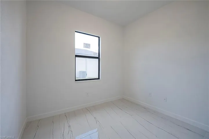 Empty room with baseboards