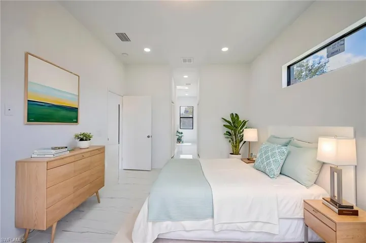 Bedroom featuring connected bathroom and recessed lighting