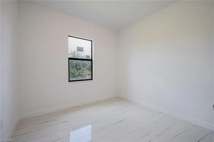 Spare room with baseboards