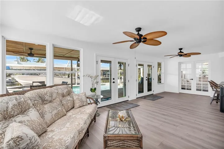 Beautiful Florida room leading to outdoor living and french doors to Master Bedroom - VIRTUALLY ENHANCED