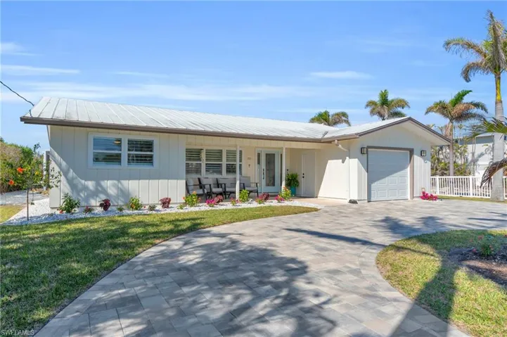 Ranch-style house with paved circle driveway - VIRTUALLY ENHANCED