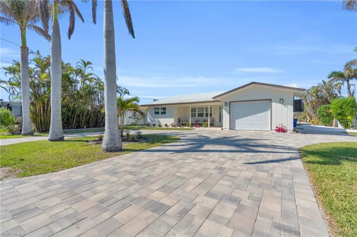 Ranch-style house with paved circle driveway - VIRTUALLY ENHANCED