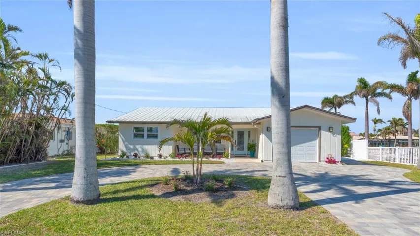 Ranch-style house with paved circle driveway - VIRTUALLY ENHANCED