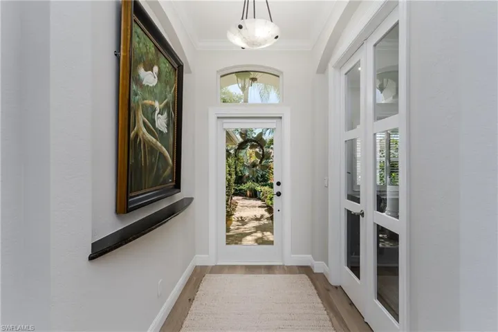 Office is located off the Foyer with glass french doors.