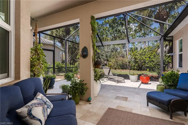 Extended Lanai with Travertine Pavers and PANORAMIC screen.