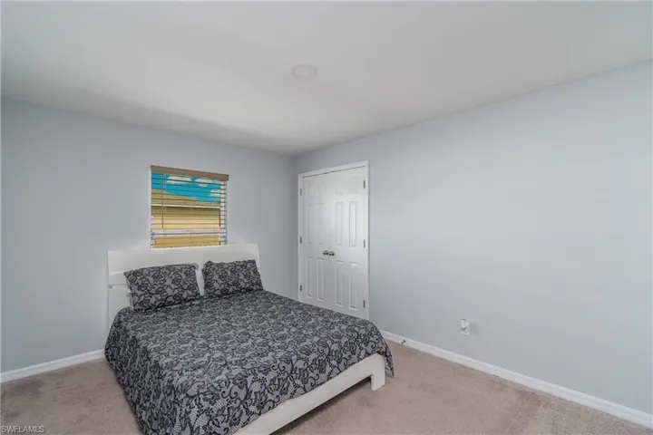 Bedroom with carpet flooring and a closet