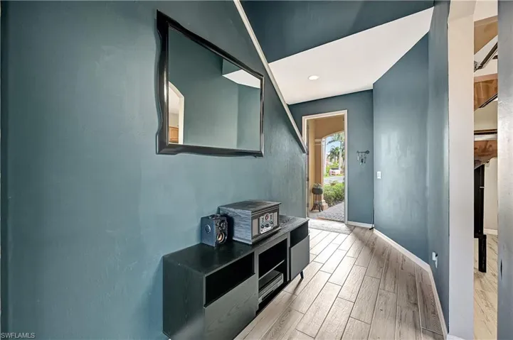 Corridor featuring light hardwood / wood-style flooring