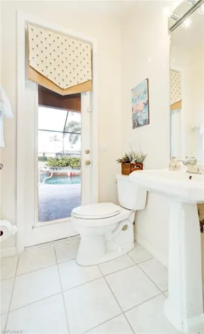 Bathroom with tile patterned flooring and toilet