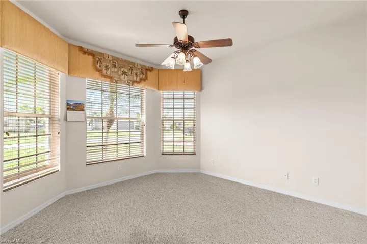 den/office  with ceiling fan
