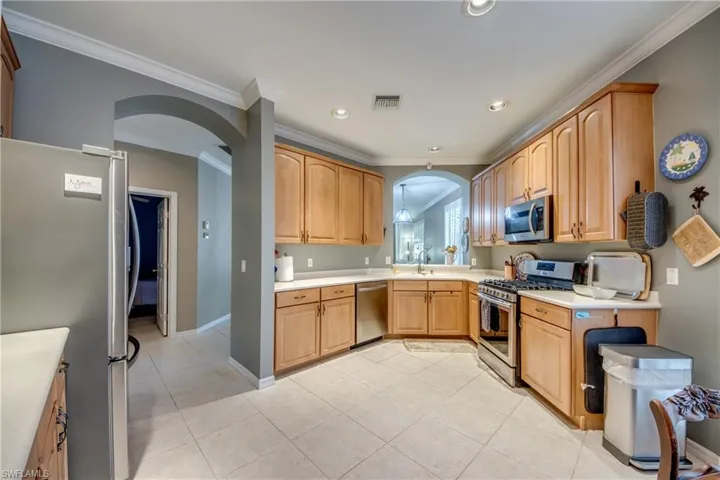 View of spacious kitchen area with lots of countertop space from kitchen table
