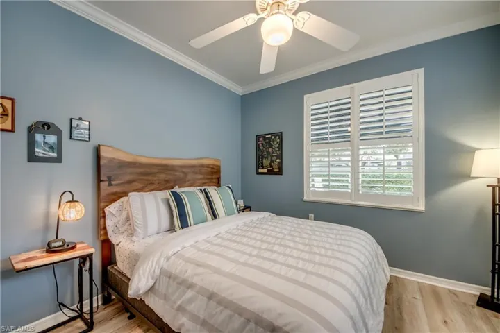 Guest bedroom with queen bed, plantation shutters