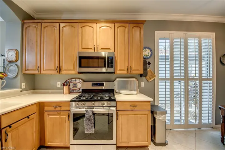 Stainless Gas Range, Bright with Sliding door to outside, plantation shutters