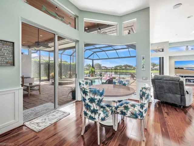 Breakfast room with pool and water views.