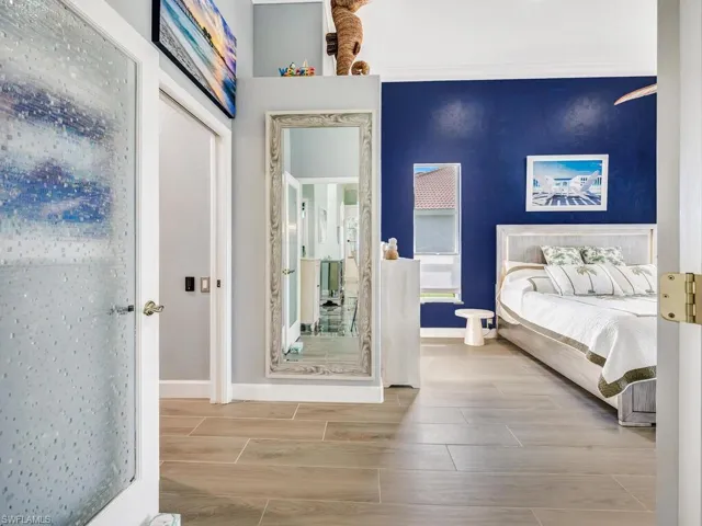 Primary Suite with new plank tile flooring.