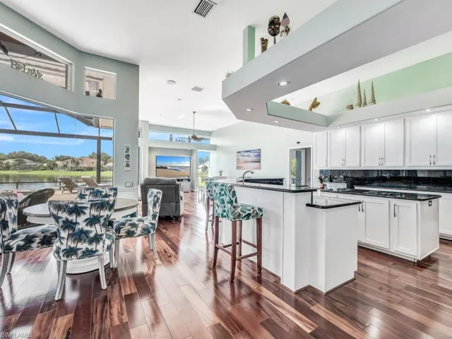 Brazilian wood floors, large island, and stunning water views.