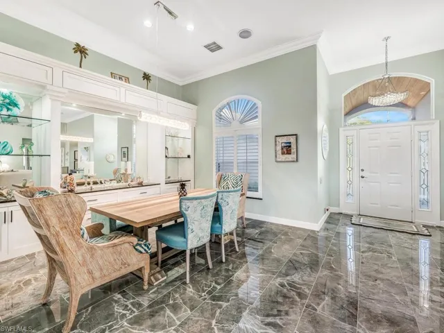 Built-in wood cabinetry, designer light fixtures and polished floors.