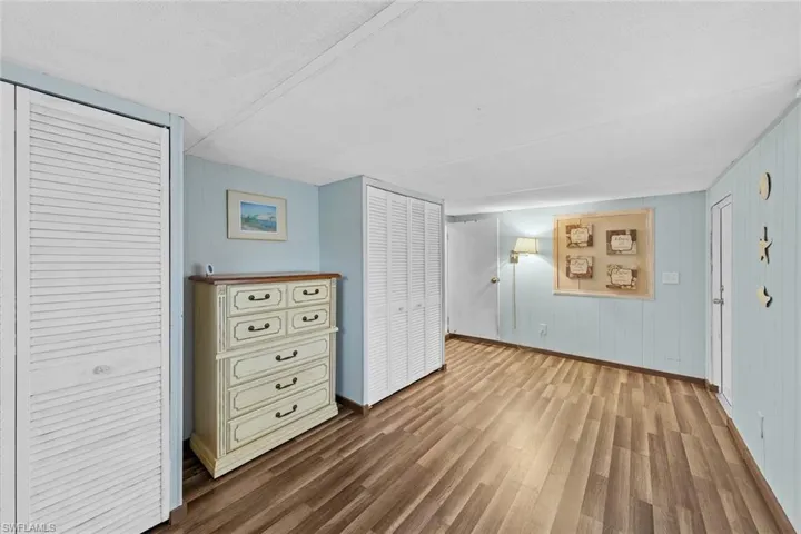 Unfurnished bedroom with wood-type flooring and a textured ceiling