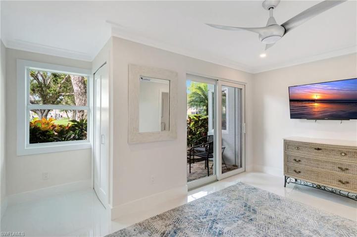 SECOND BEDROOM/OFFICE/DEN WITH CLOSET AND PATIO DOOR OUT TO PRIVATE PATIO