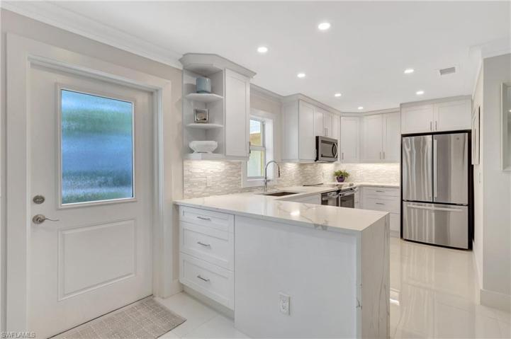 ENTRYWAY DOOR AND KITCHEN