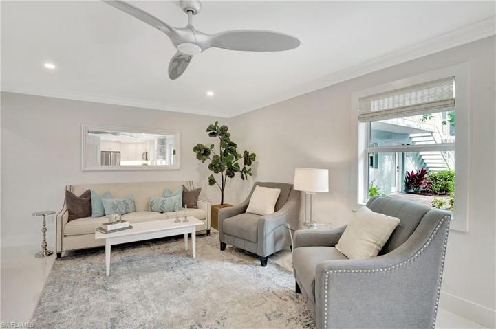 LIVING ROOM WITH VIEW OF LANDSCAPED COURTYARD