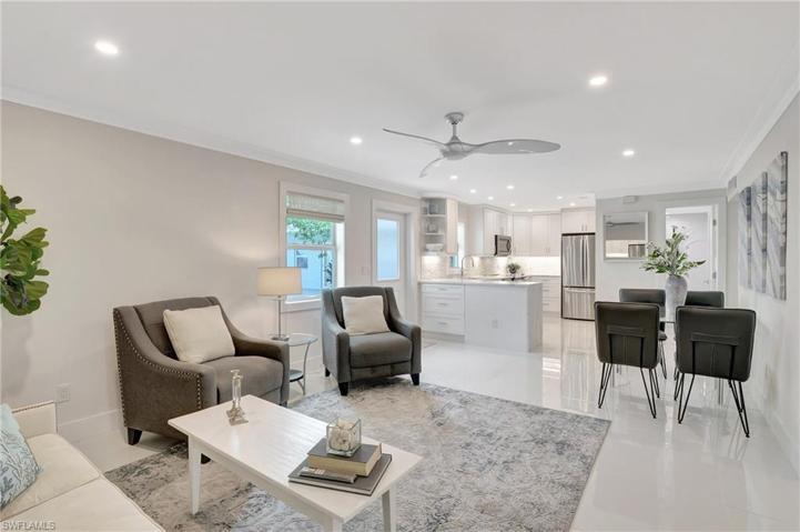 LIVING ROOM LOOKING INTO DINING AREA AND KITCHEN