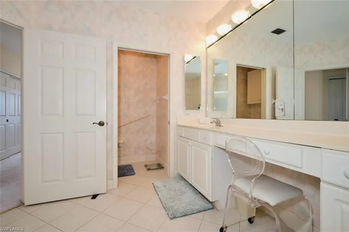 Bathroom with vanity and tile patterned floors