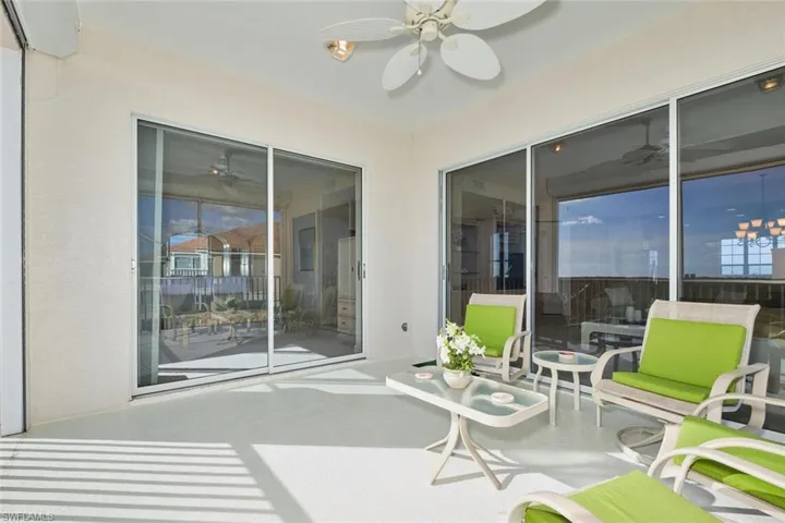 Sunroom featuring ceiling fan