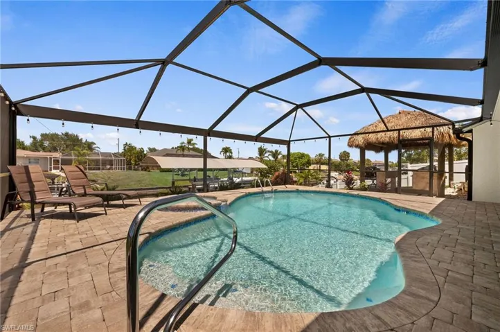 Pool overlooking Dock, Canal and Tiki