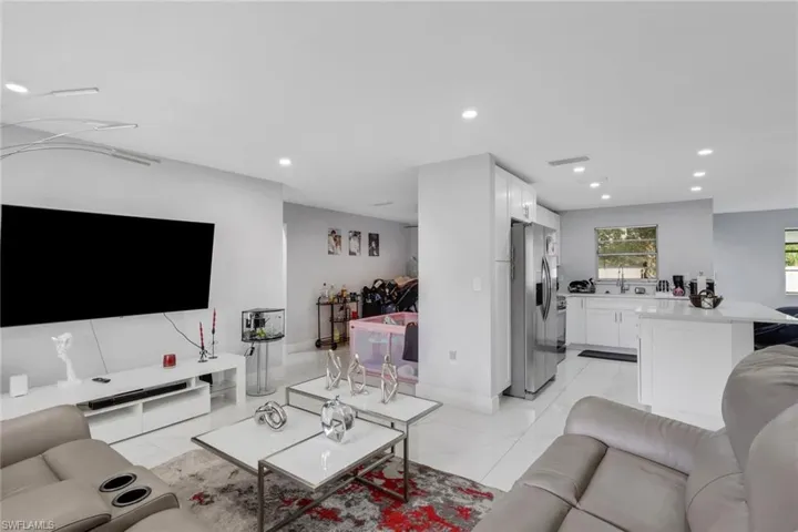 Open-concept living space featuring recessed lighting and tile flooring