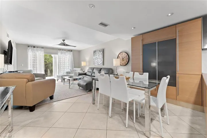 Dining room featuring a ceiling fan, light tile patterned floors, recessed lighting, and visible vents