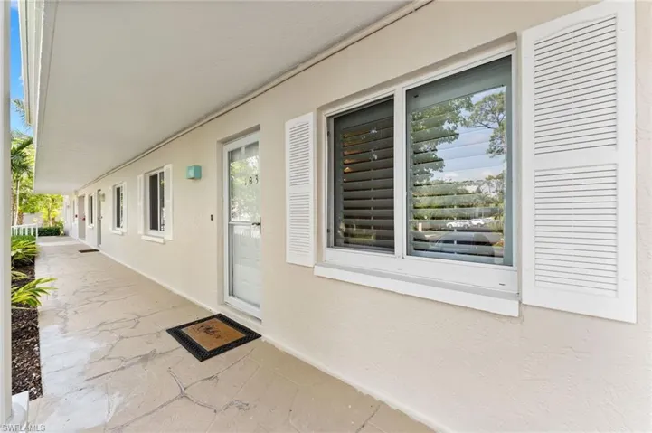 Entrance to property with stucco siding