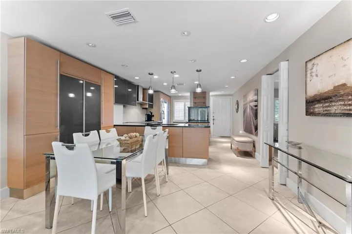 Dining room with baseboards, visible vents, recessed lighting, and light tile patterned floors