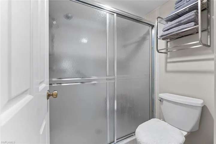 Bathroom with toilet and a shower stall