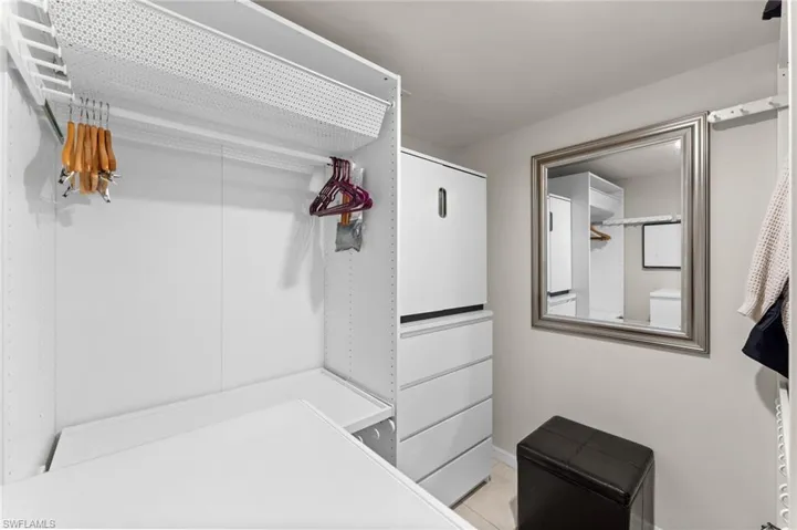 Walk in closet with tile patterned floors