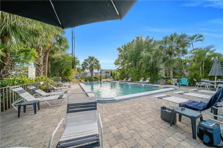 Community pool with a patio area