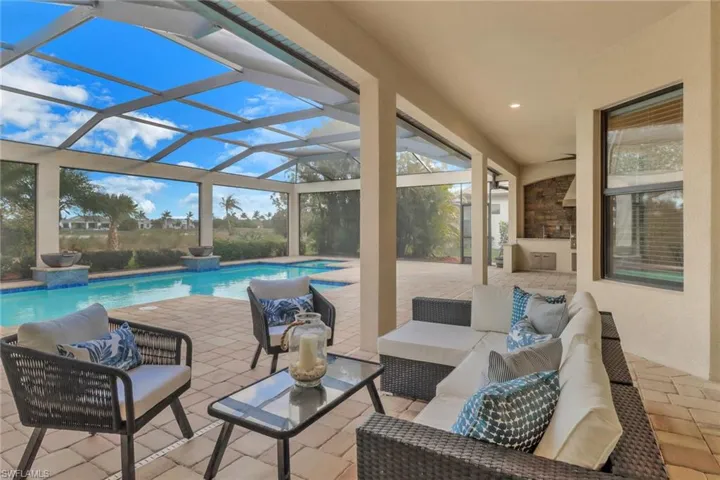 View of patio / terrace featuring an outdoor pool ,an outdoor kitchen and an outdoor living space
