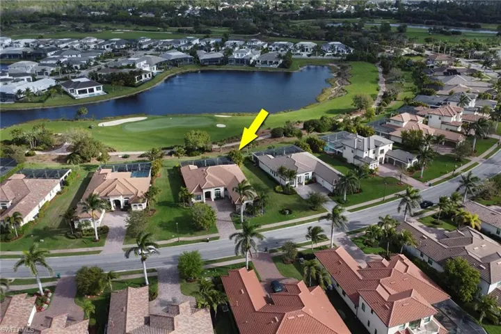 Birds eye view of property with a residential view, view of golf course, and a water view
