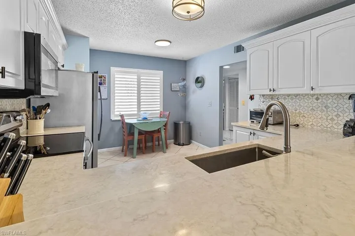 Plenty of space in this kitchen, pantry and lots of cabinets.