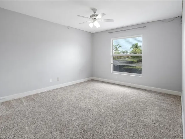 Neutral-toned carpeting paired with light grey walls