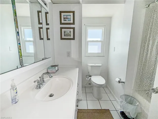 Bathroom with vanity and light tile patterned floors