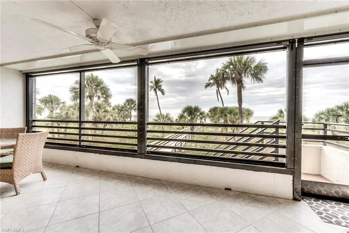 Unfurnished sunroom with tile patterned floors
