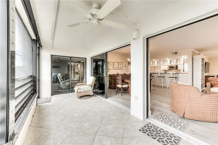 Sunroom with a ceiling fan