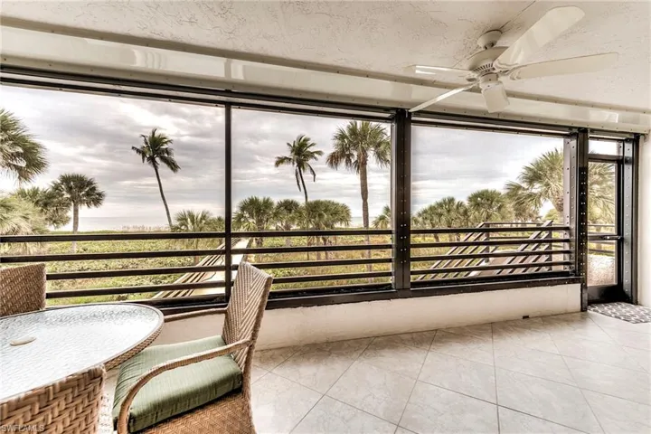 Sunroom / solarium featuring tile patterned floors