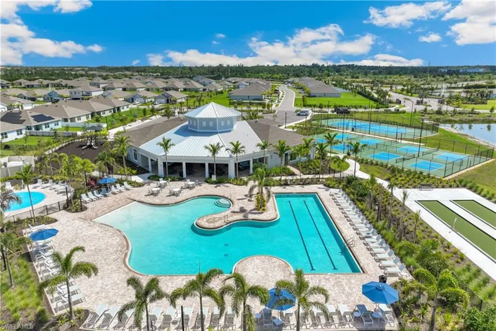 This property features a large outdoor area with a resort-style swimming pool, a separate lap pool, and a spa area