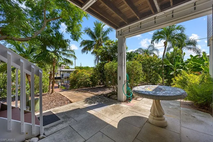 View of patio / terrace outside apartment, Back stairway to enter upstairs porch.